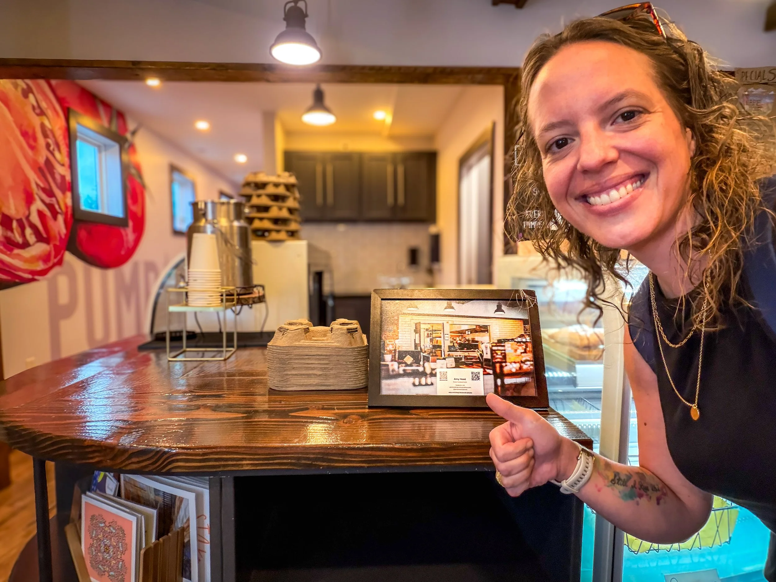 Amy Hood of Amy Hood Captures working behind the scenes on her photography business at Pumpernickel and Rye in Frederick, Maryland