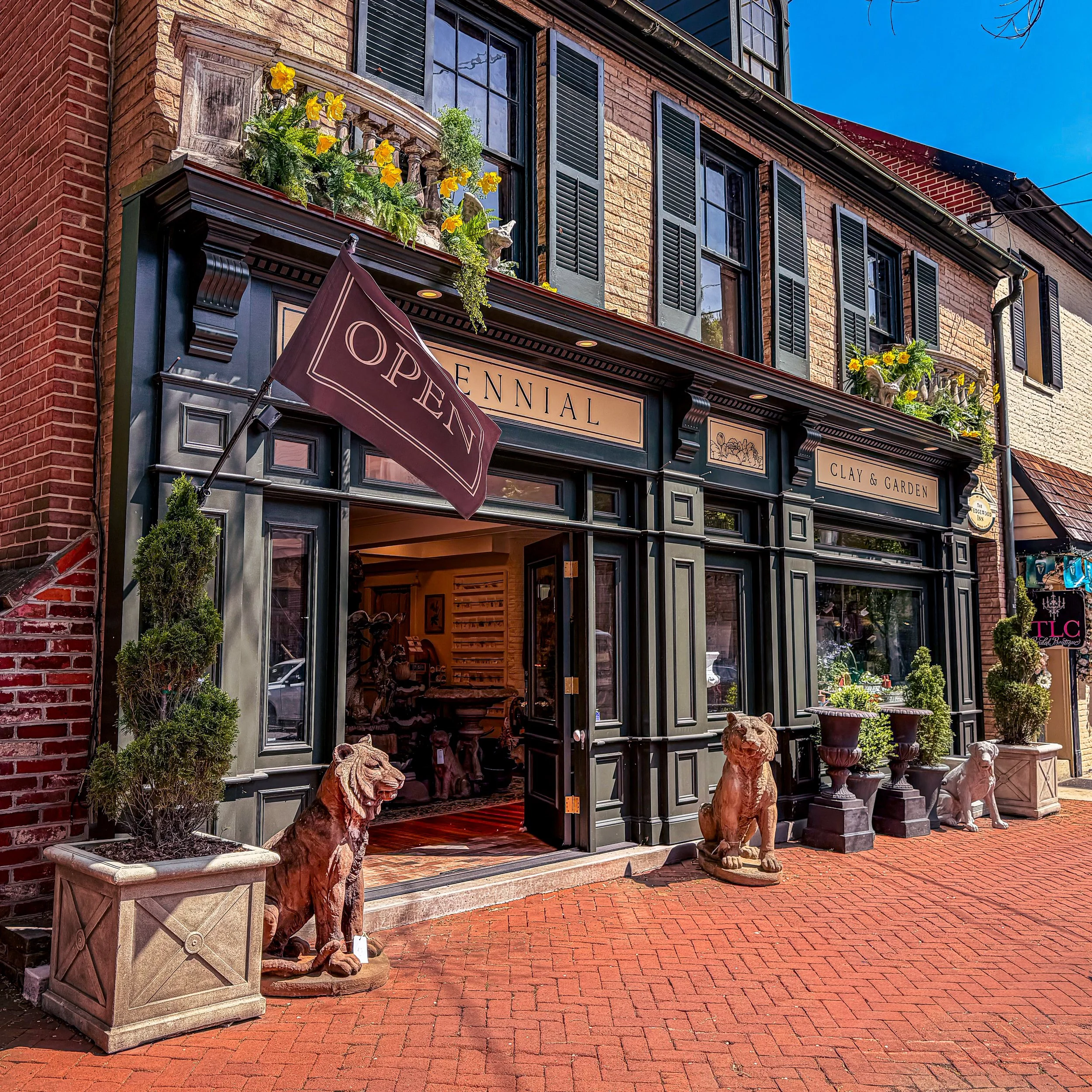 Charming downtown Frederick, Maryland storefront with brick sidewalk and outdoor seating, small business branding photography