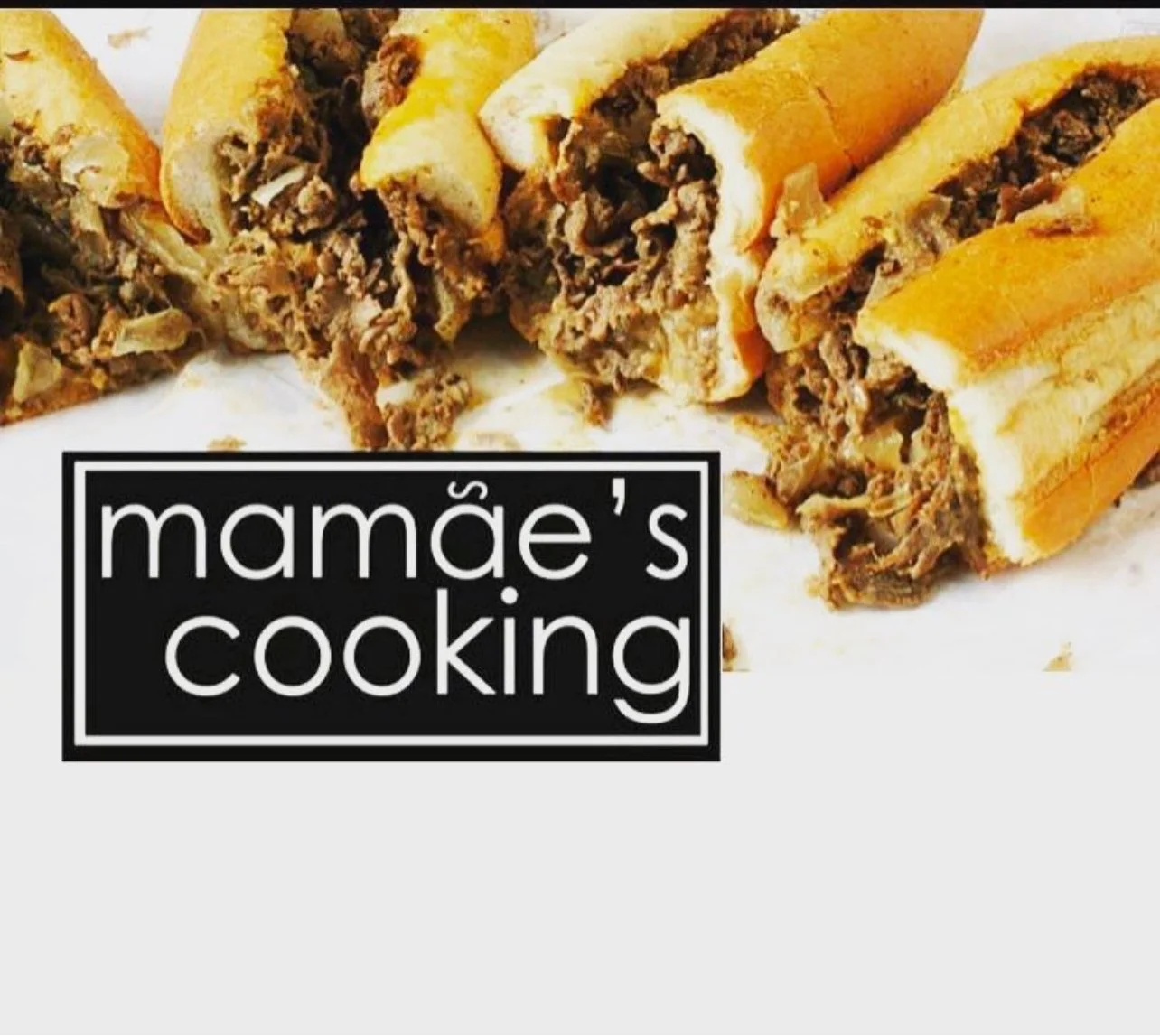 Photo of Philly cheesesteak sandwiches with sliced bread, cooked beef, and melted cheese, on white background with 'mamãe's cooking' logo
