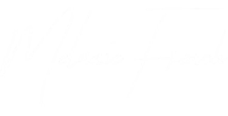 Close-up of a handwritten signature or cursive writing on a black background.
