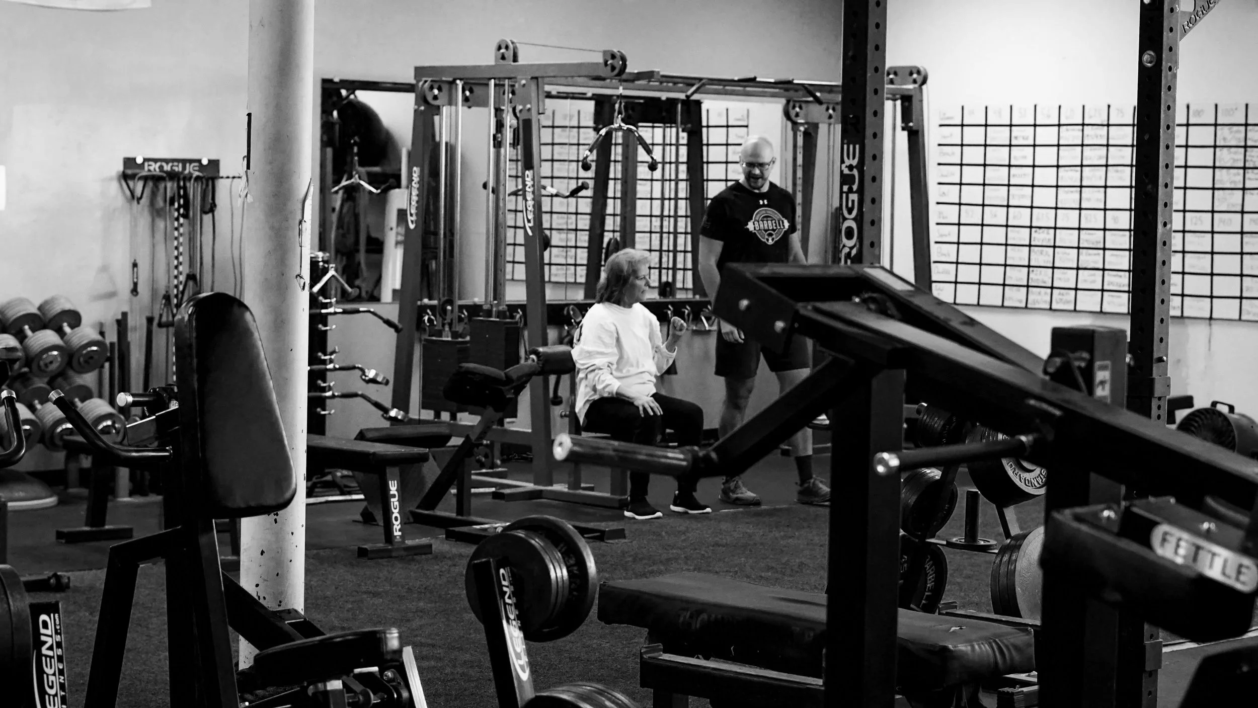 Personal training with woman at Brazos Valley Barbell in College Station Texas