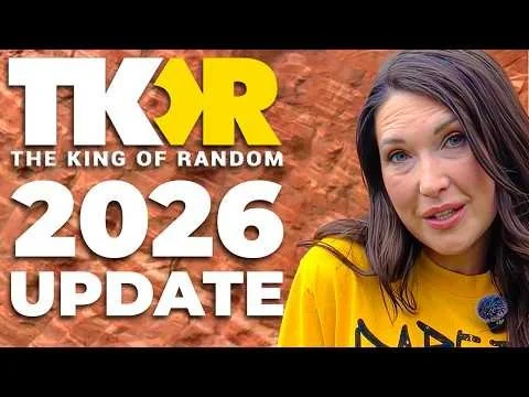 Thumbnail for a video titled "TKOR 2026 Update - The King of Random", featuring a woman with dark hair in a yellow shirt, set against a textured orange background.