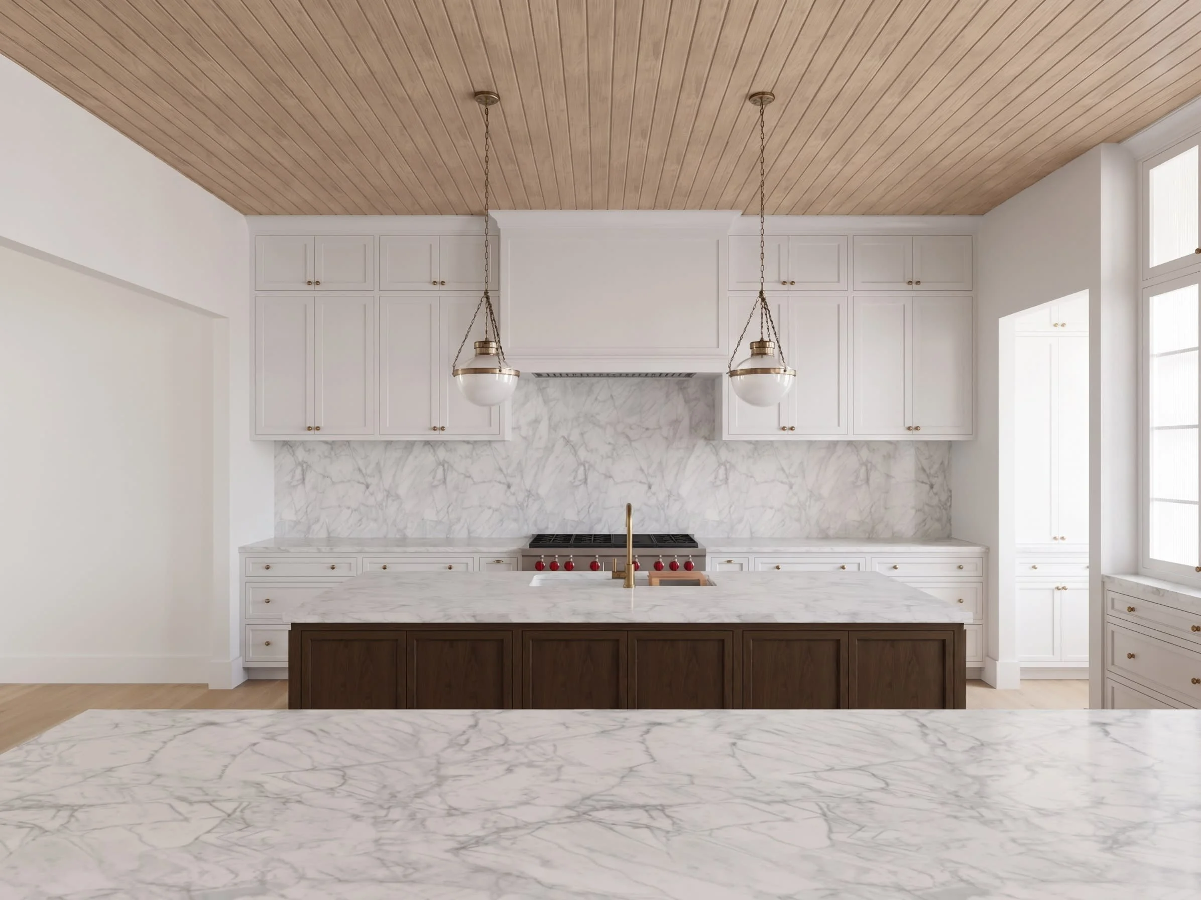Modern kitchen with white cabinets, marble backsplash, wooden ceiling, and marble countertops and island, illuminated by natural light from large windows.