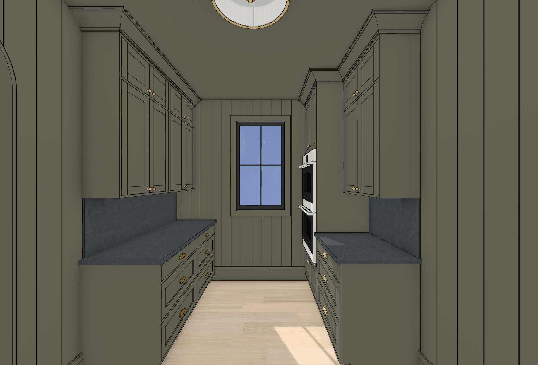 Pantry with upper and lower cabinets painted in a deep green color, featuring gold knobs. There are black countertops, a window at the end of the room, and a built-in double oven on the right side.