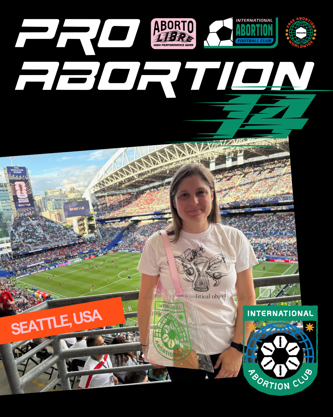 A woman at a football stadium during a match, wearing a white t-shirt with a graphic and text, holding a transparent bag with a green logo, in Seattle, USA, with banners supporting the international abortion club, and various sponsor logos, filled with spectators and a partially cloudy sky.