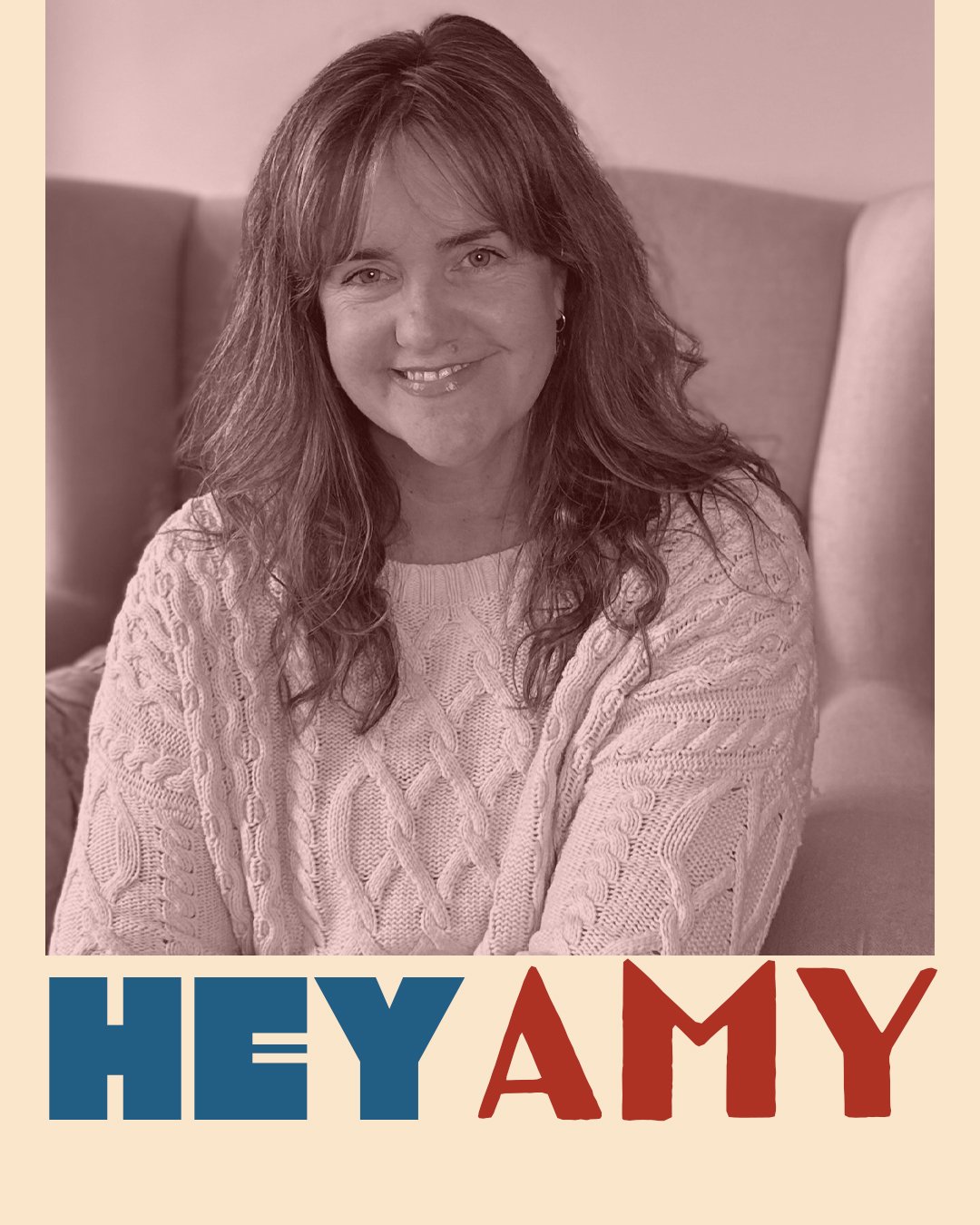 A woman with wavy hair sitting on a sofa, smiling, wearing a knitted sweater, with text "HEY AMY" in bold letters at the bottom.