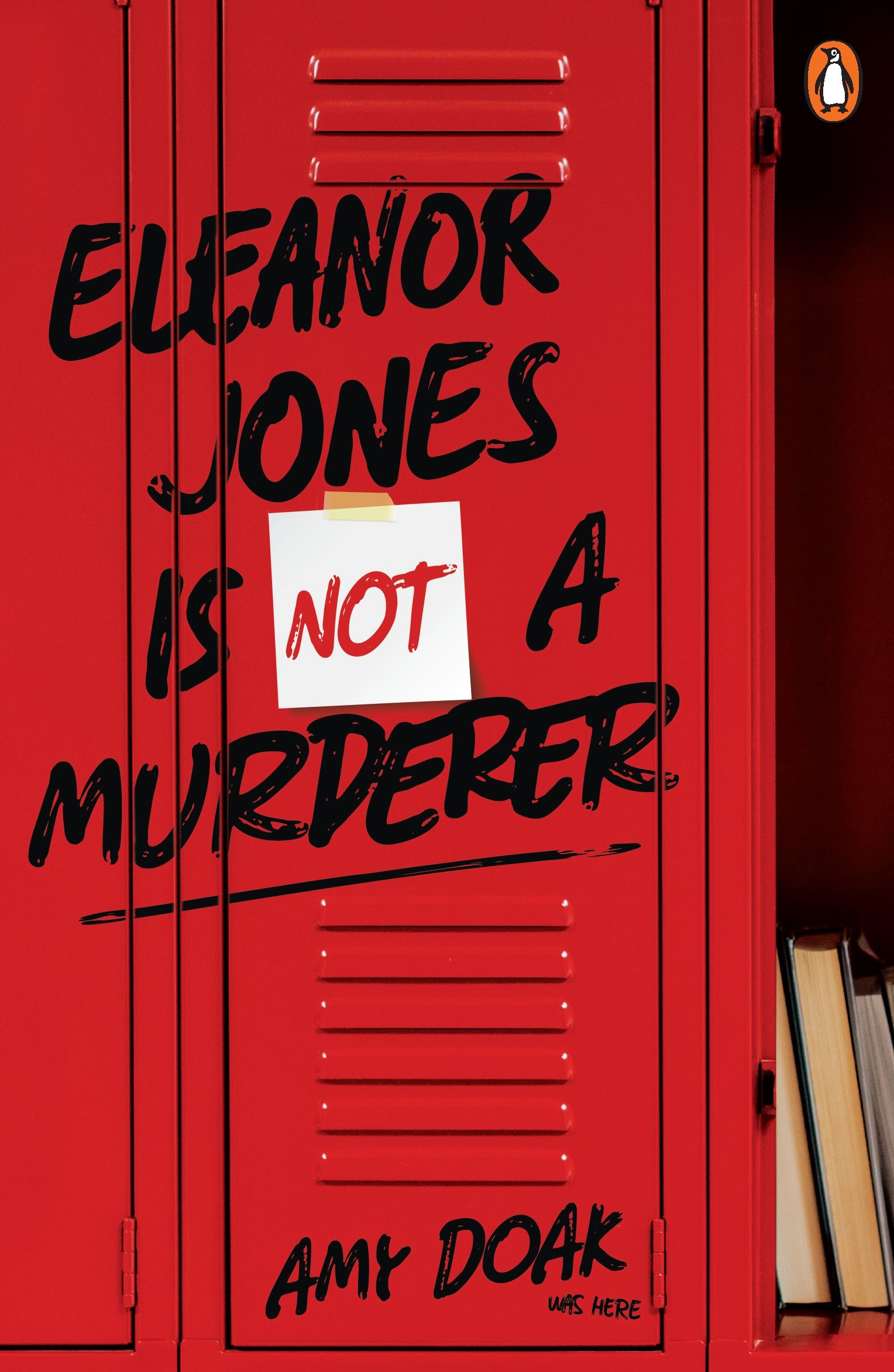 Red school locker with black handwritten text and a white note that says 'NOT' taped on it. The locker has a small book tucked to the covered right side.