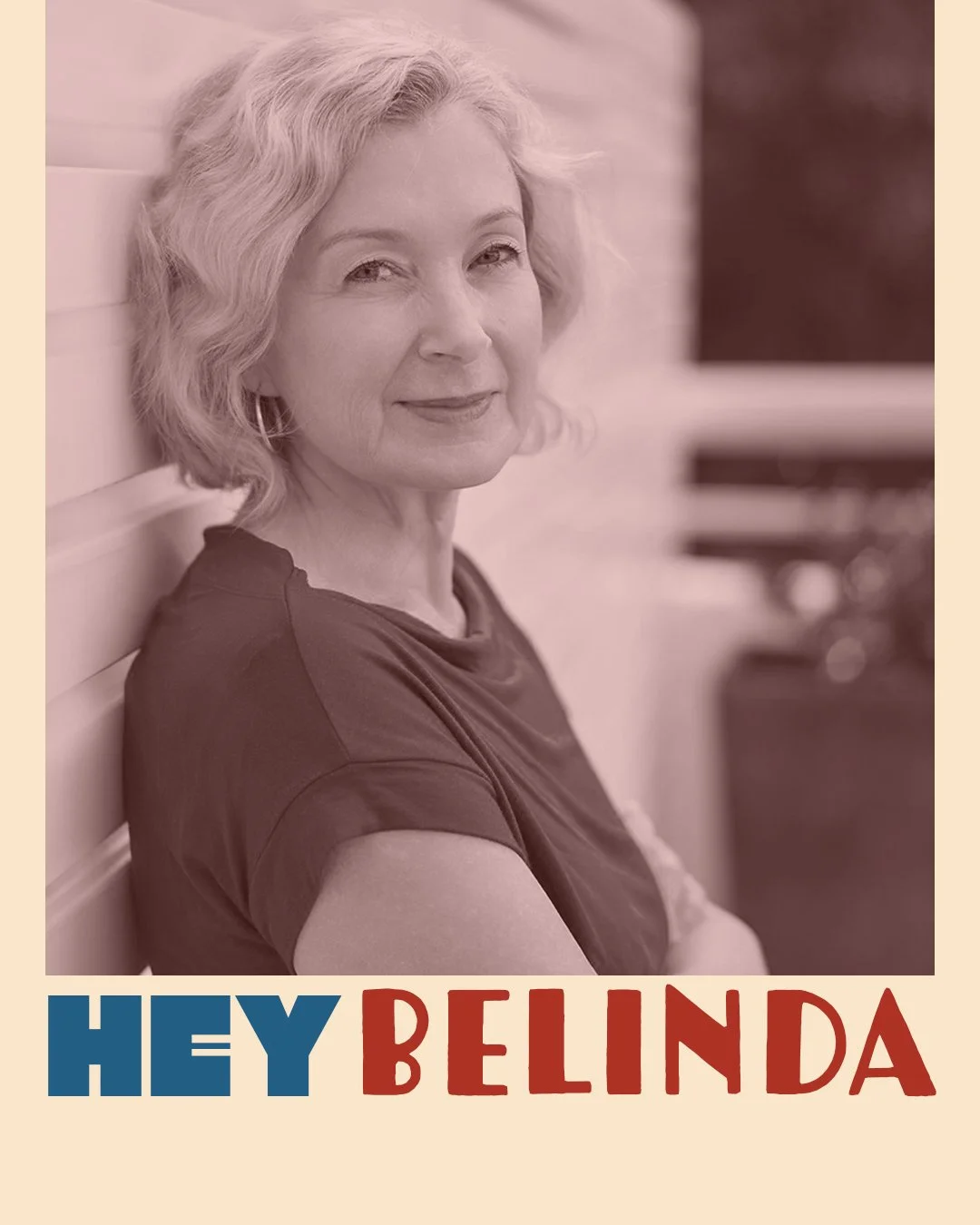 A woman with wavy hair smiling while sitting against a wood-paneled wall, with the text "Hey Belinda" at the bottom.