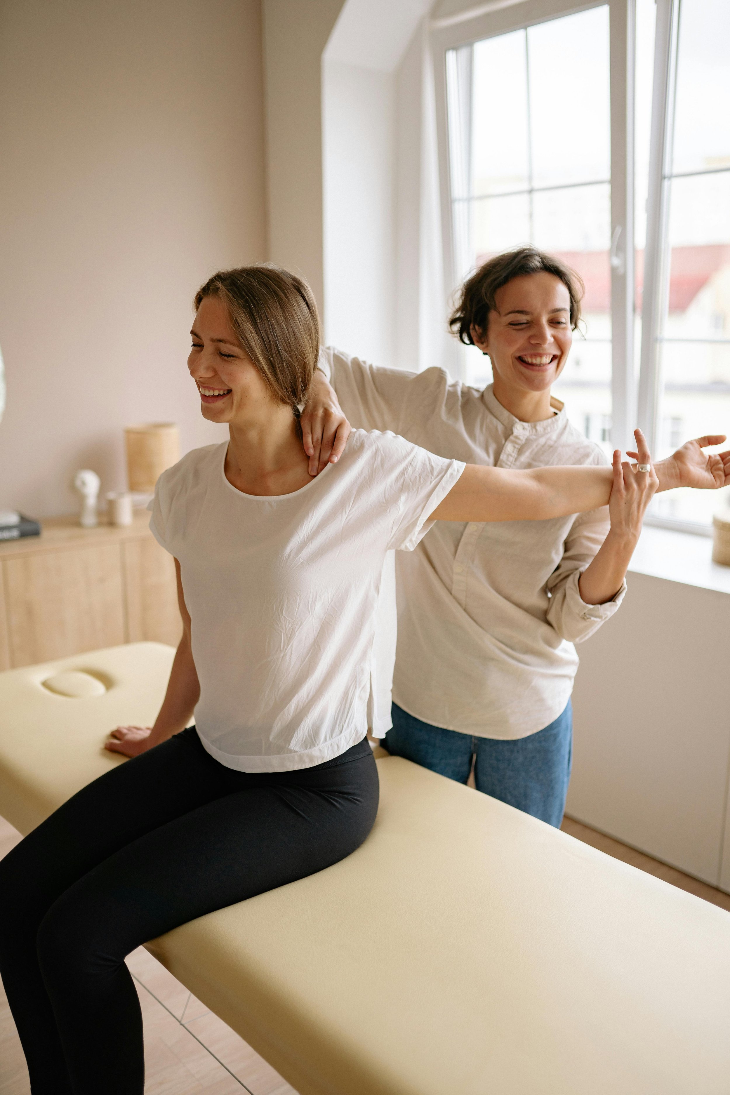 woman receiving therapy, energy healing, bodywork, integrative health, holistic therapy, pain relief, stress management, pain management, body wellness