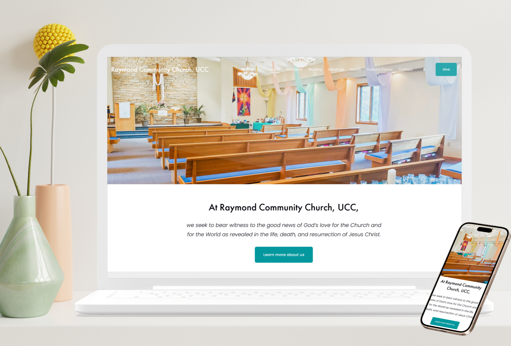 A church interior with wooden pews and colorful streamers hanging from the ceiling.