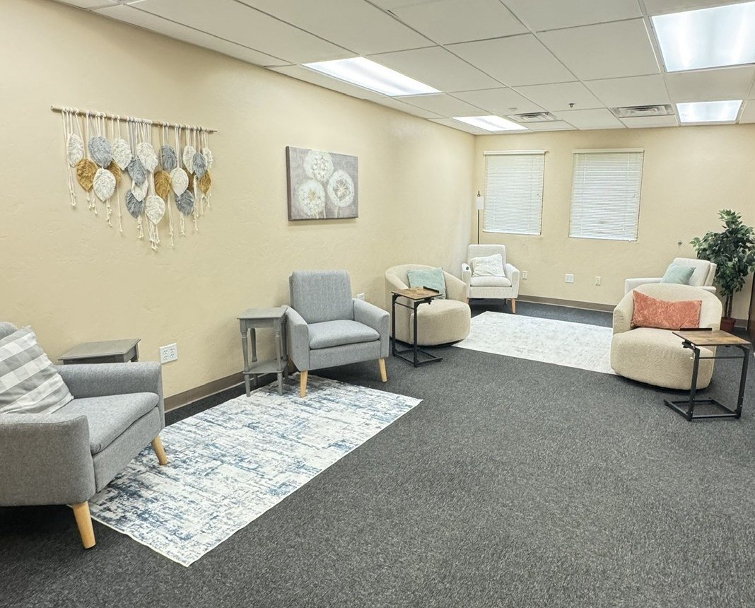 The Lounge at Aligned Cowork, a quiet phone-free room with cozy armchairs and soft rugs in Prescott Valley, AZ