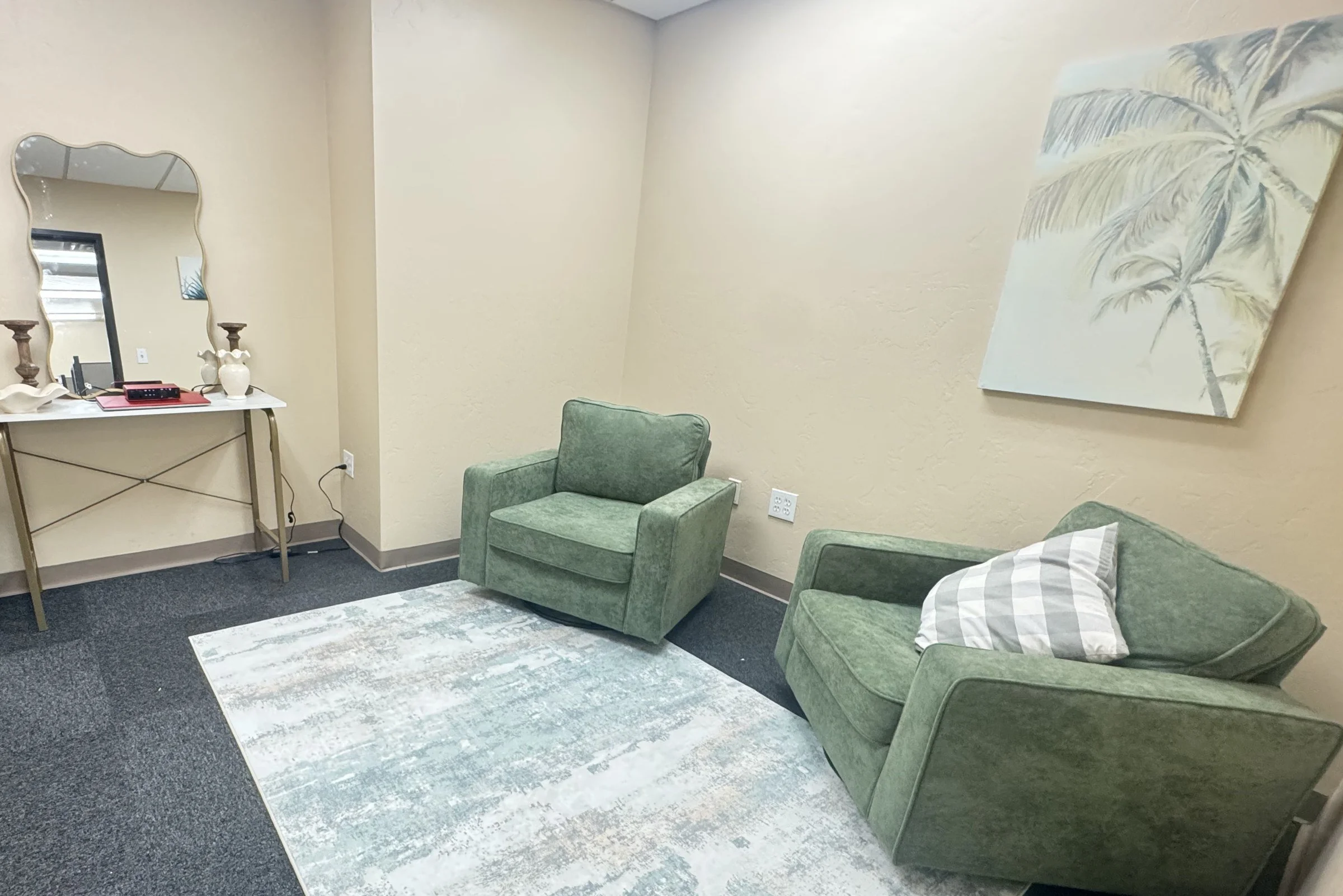 The Studio with two green swivel lounge chairs