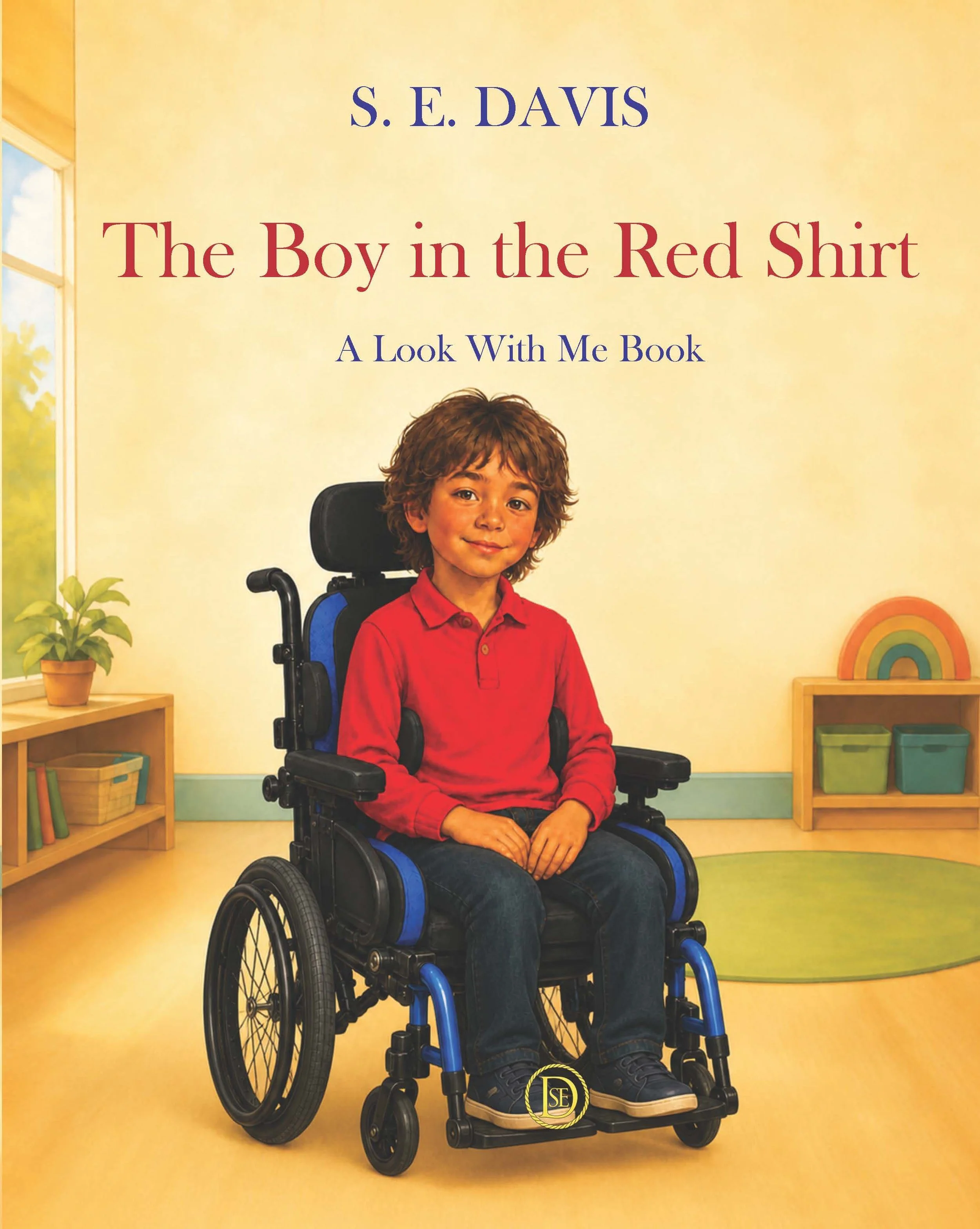 dark haired boy wearing a red shirt sitting in a wheelchair in a clutter free room
