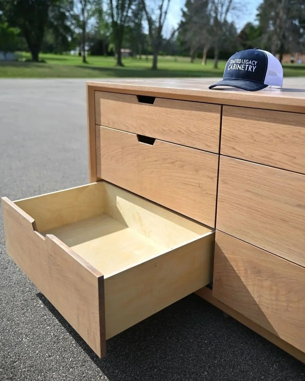 A wooden cabinet with a partially open drawer,.Mid century modern dresser. Avocado inspired White oak dresser Minimalist dresser Handcrafted Minimalist furniture White oak dresser
