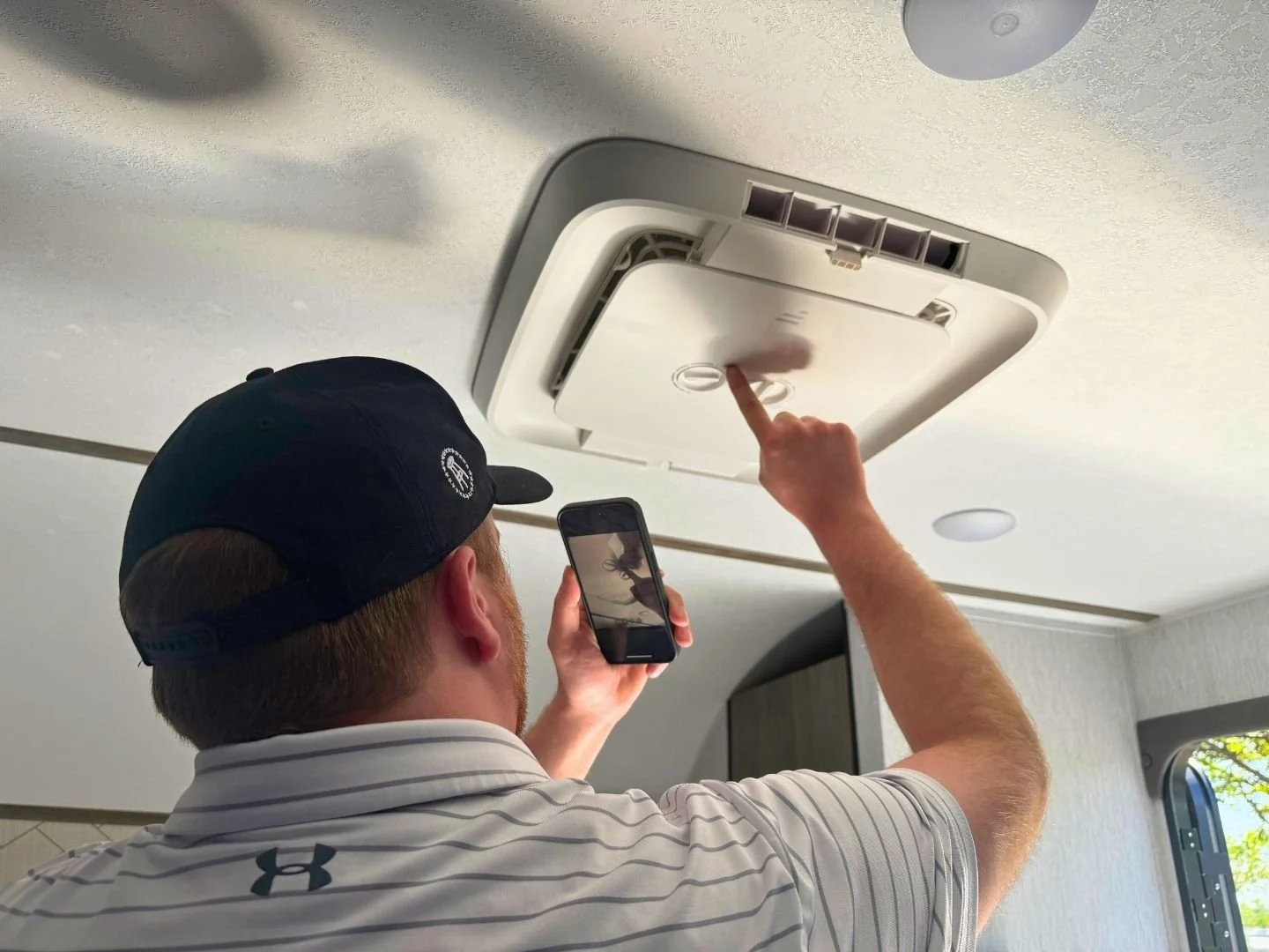 Troubleshooting an air conditioner on a video call with a certified RV technician through RVFix
