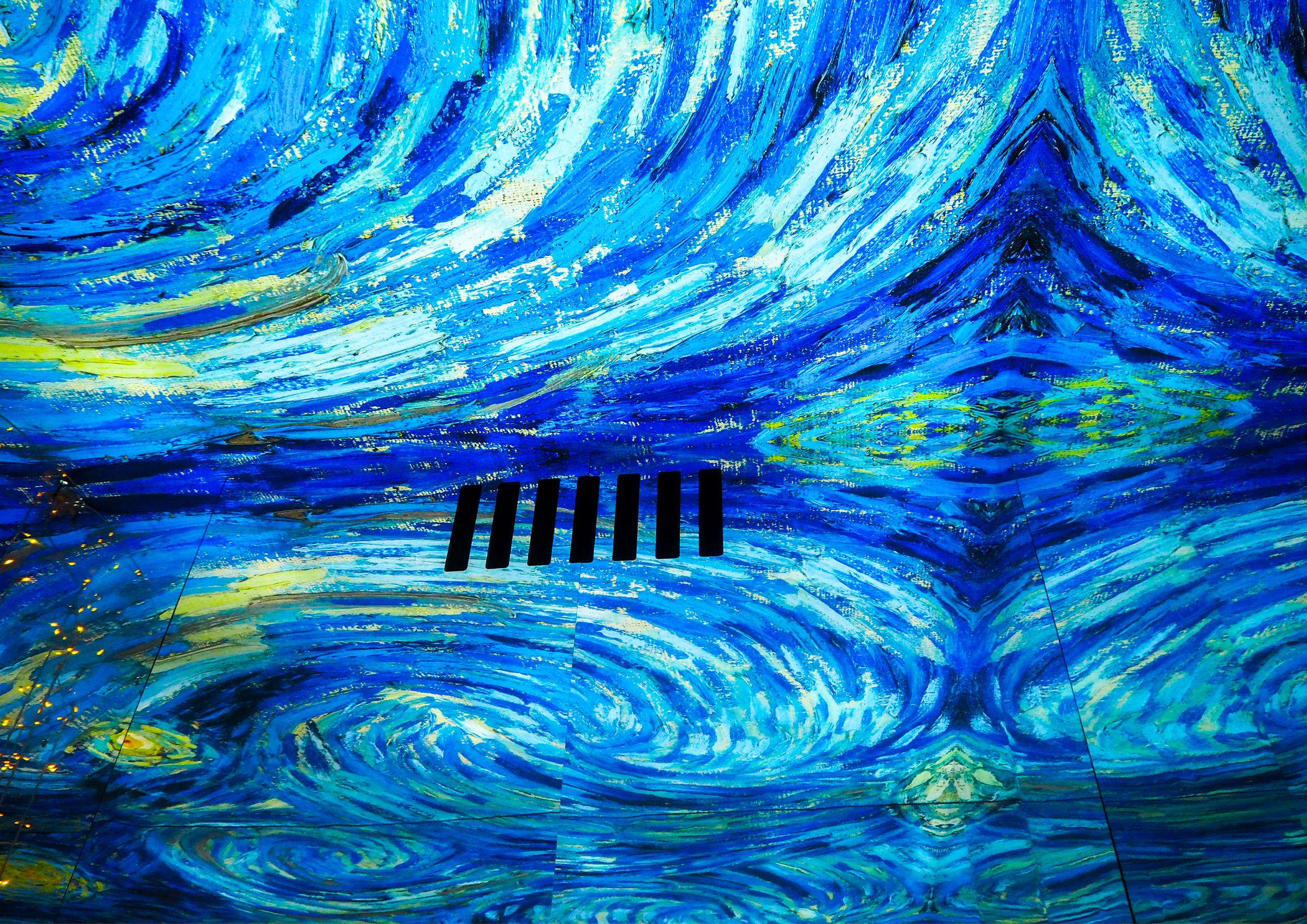 Colorful abstract painting with swirling blue, yellow, and white patterns, resembling a turbulent ocean or sky with a small section of black vent in the center bottom.