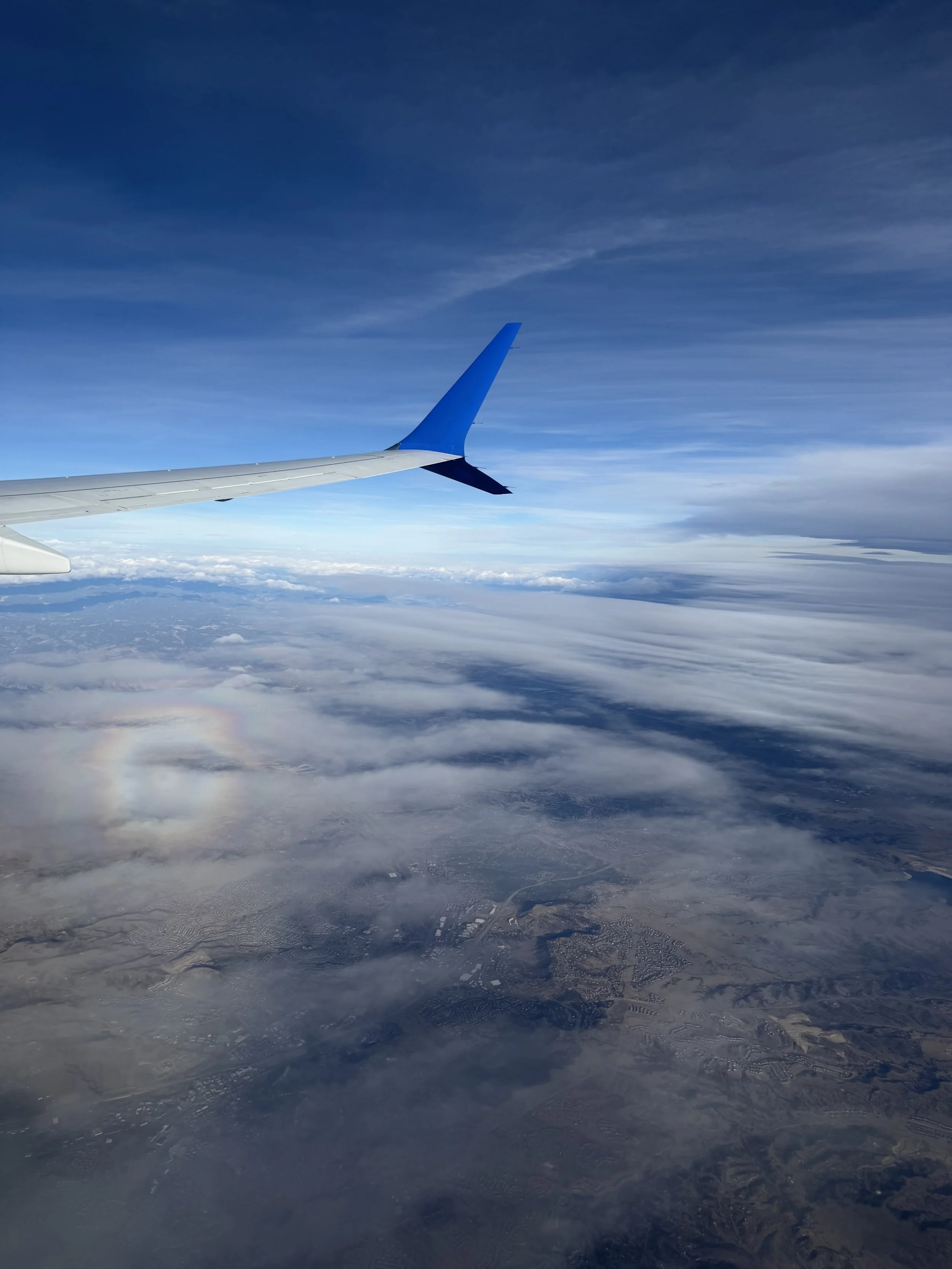 small round rainbow from the view of a plane