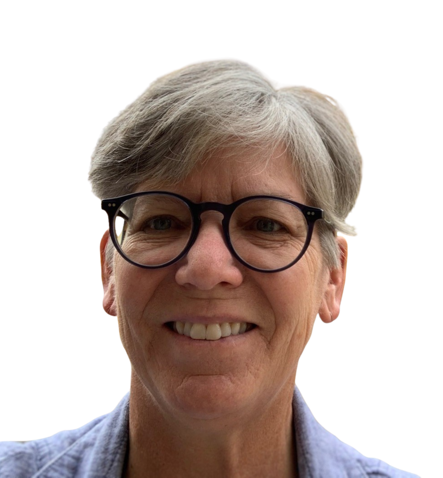 Close-up of Therapist Patty Podhaisky with short gray hair, black-rimmed glasses, and a collared shirt.