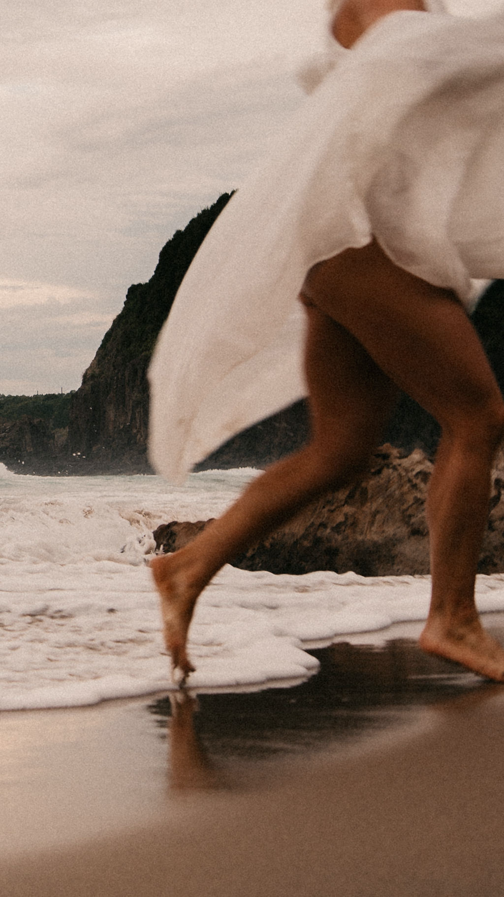 woman running on beach with smooth legs