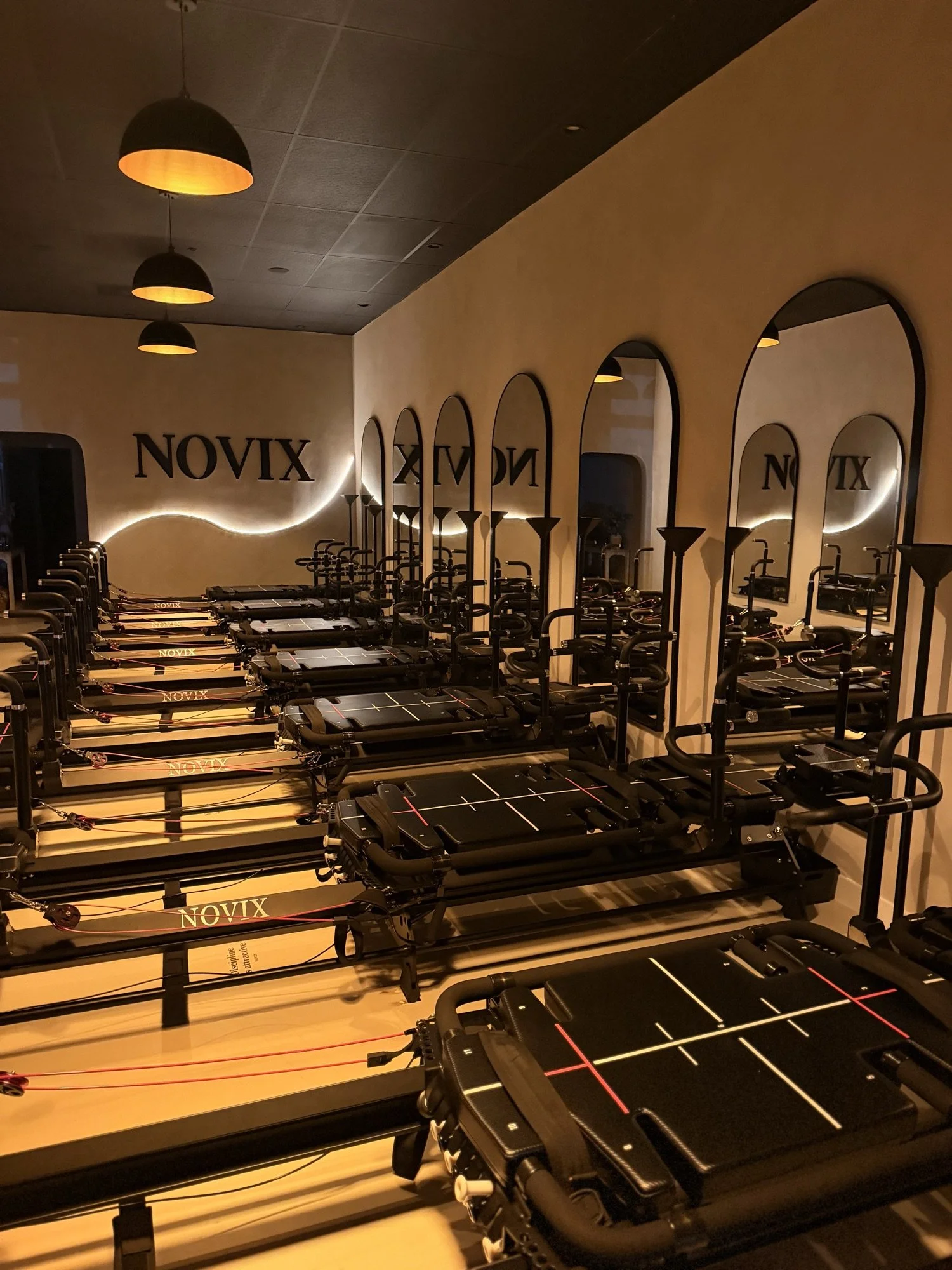 NOVIX reformer Pilates room set for an evening class in Rowland Heights