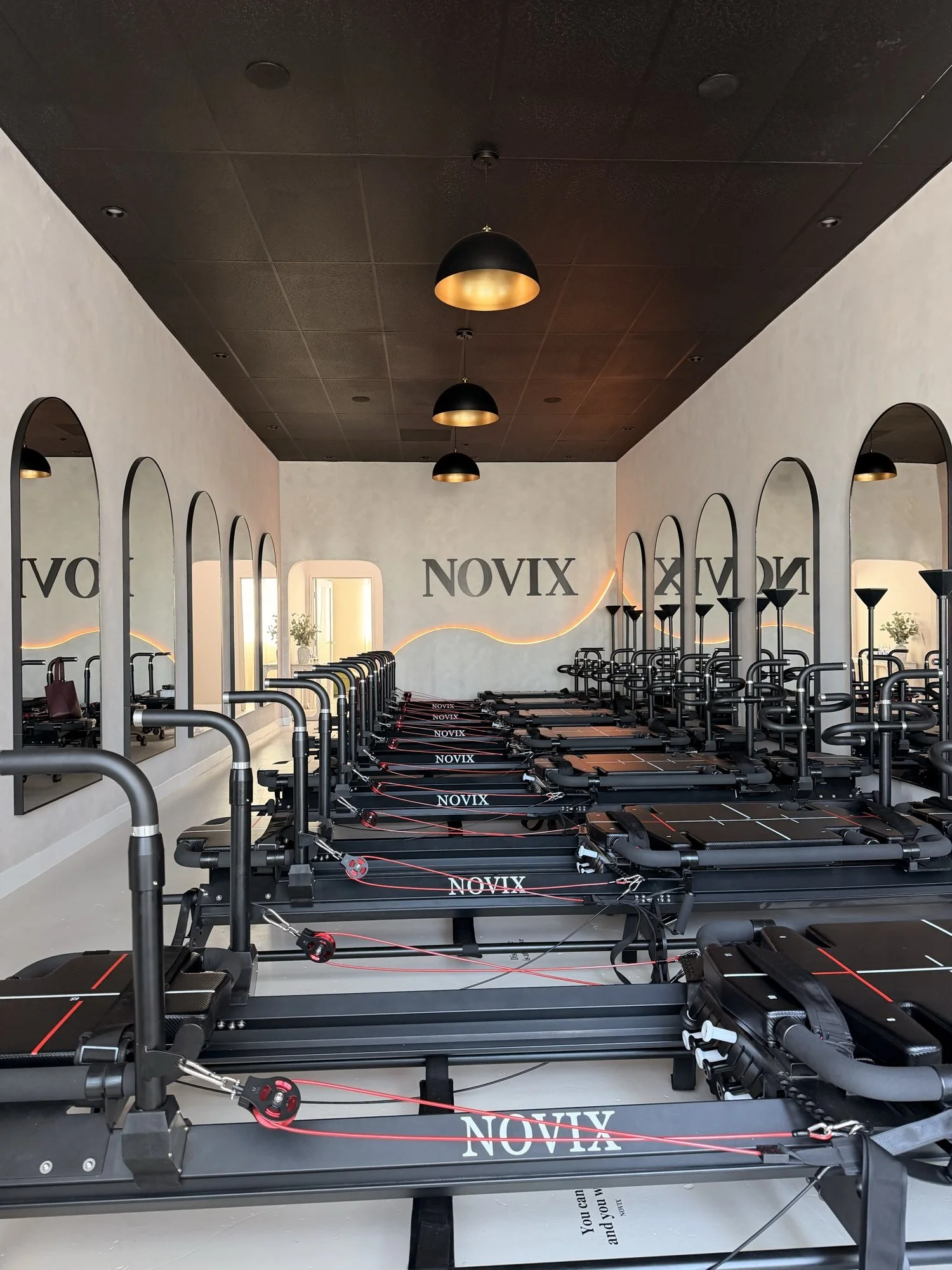 Seven reformers inside NOVIX boutique reformer Pilates studio in Rowland Heights
