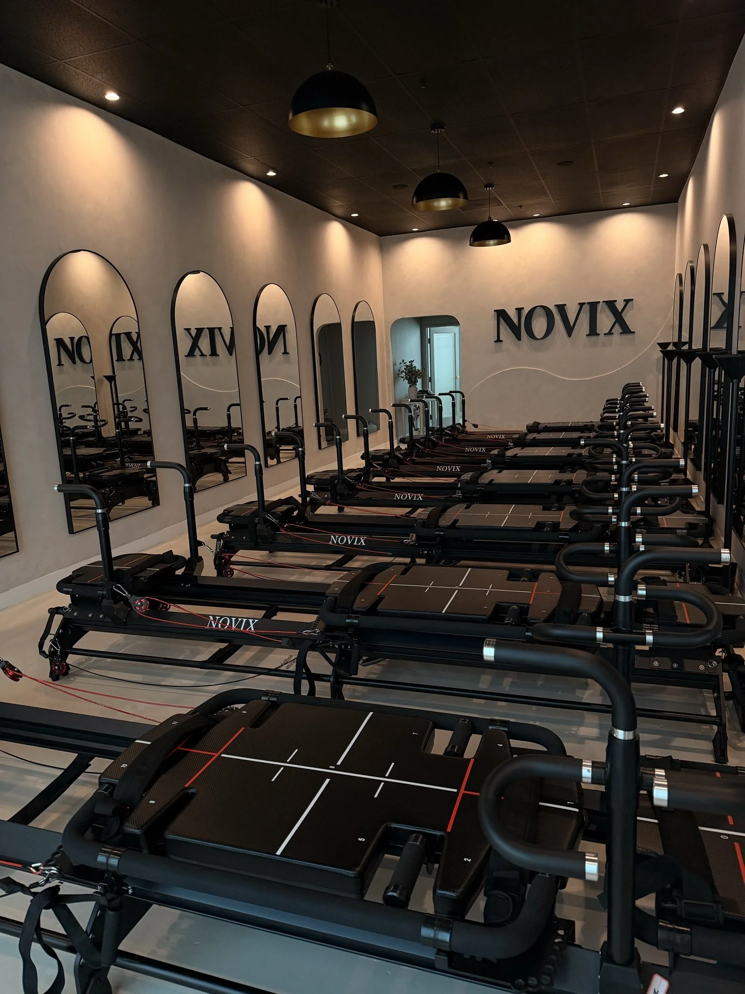 Reformer Pilates studio with arched mirrors at NOVIX in Rowland Heights