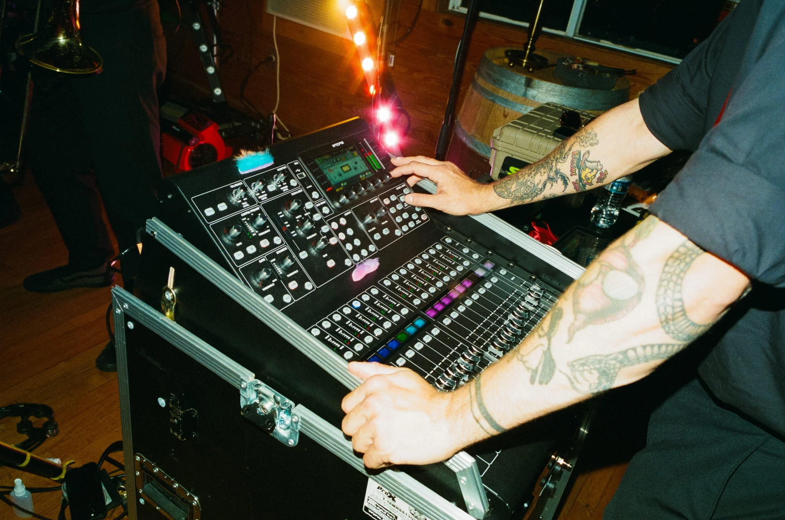 RDAV technician running an audio mixing board at a live event