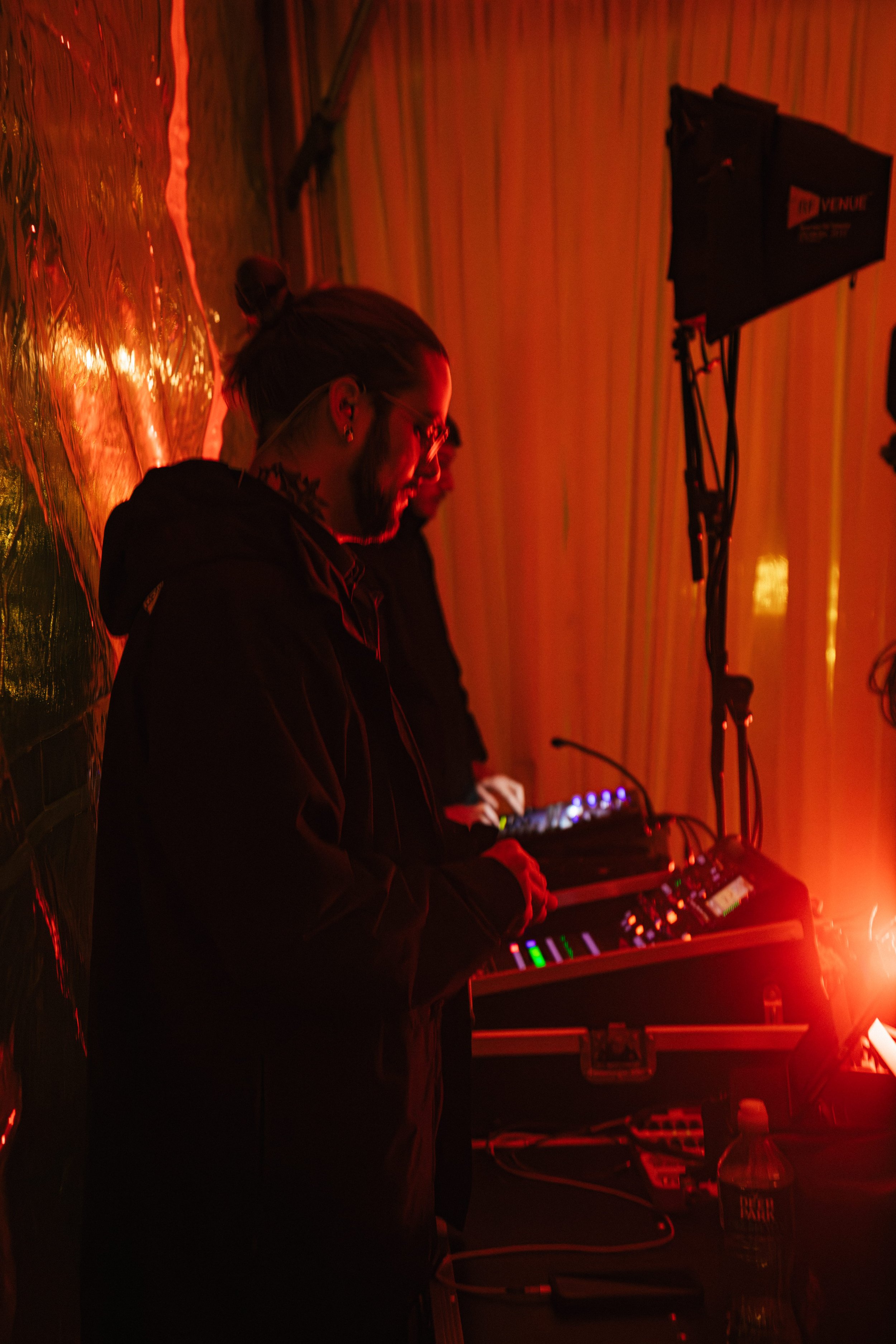 RDAV technician operating an audio mixing board at a live event