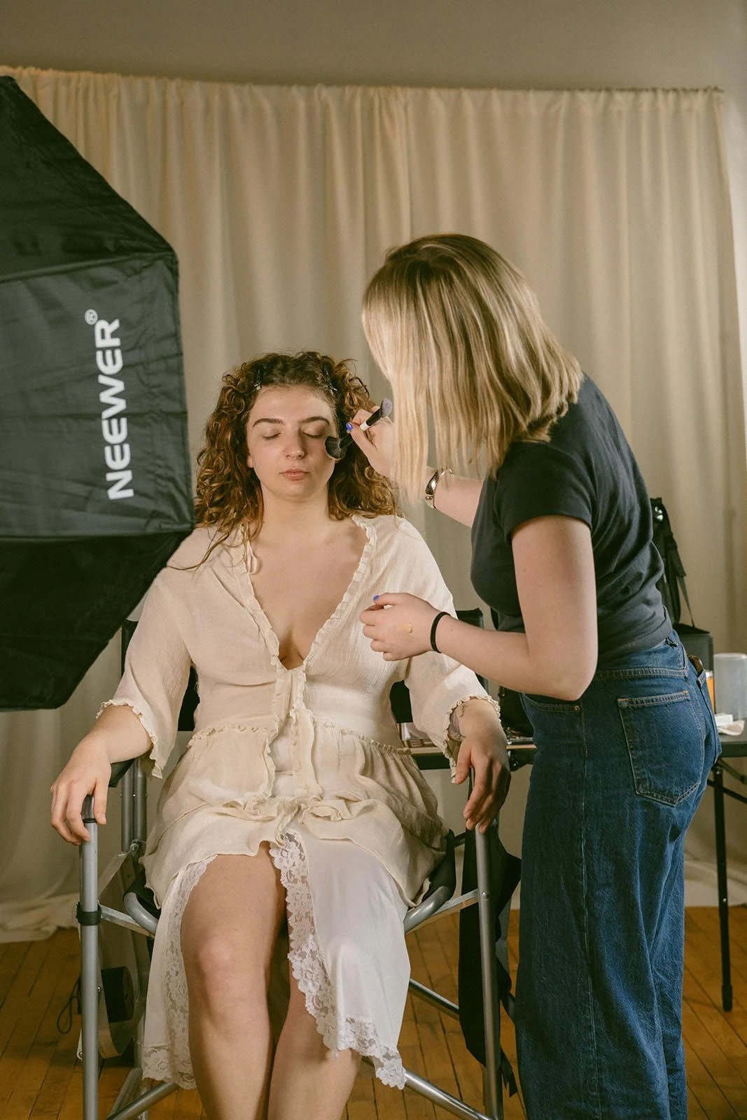 Minnesota bridal makeup artist applying  makeup at a commercial shoot