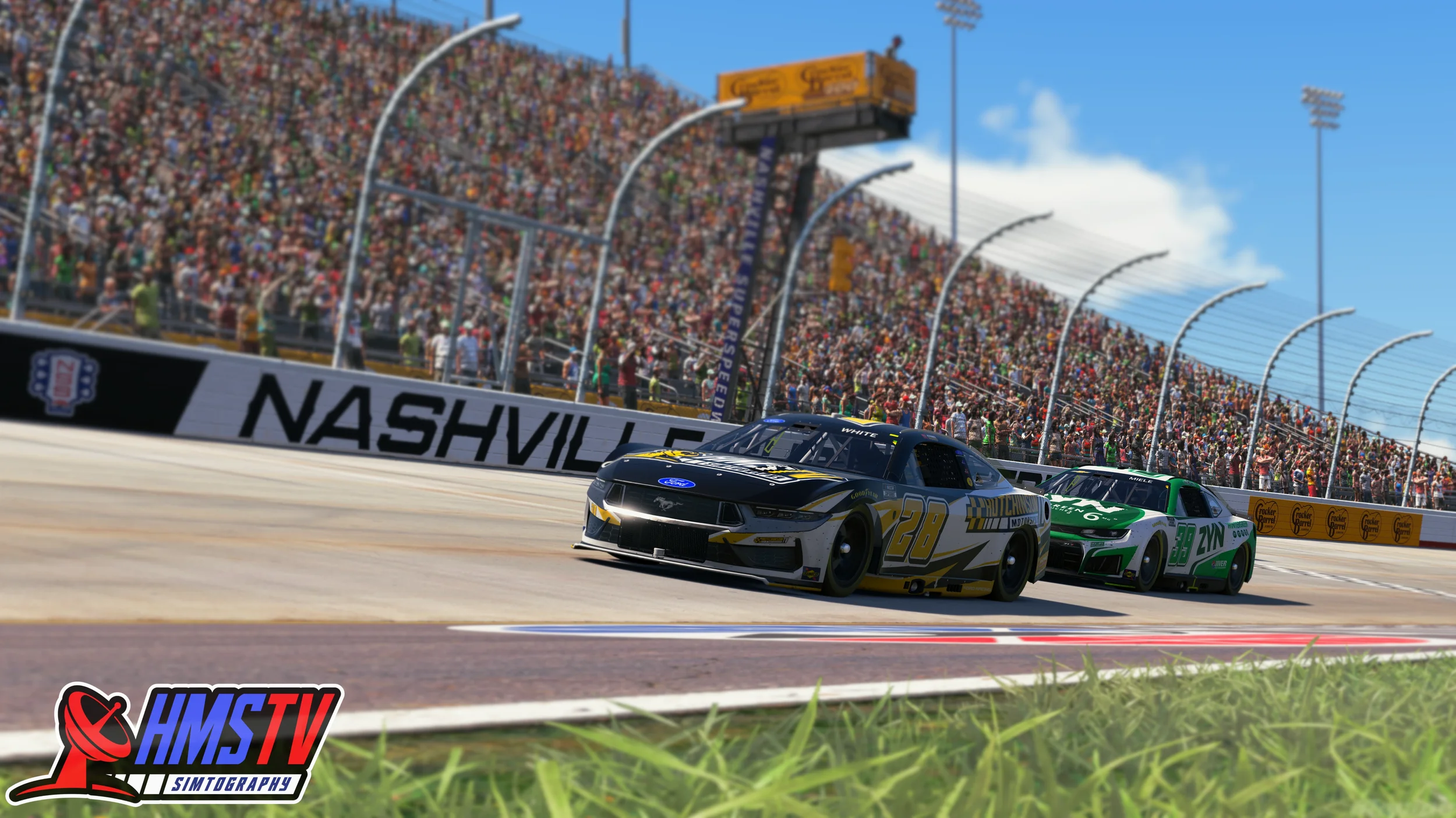 Two race cars, one black and white with the number 20 and the other green with the number 98, racing on a track at Nashville Superspeedway while a large crowd watches from the grandstands and the sky is partly cloudy.