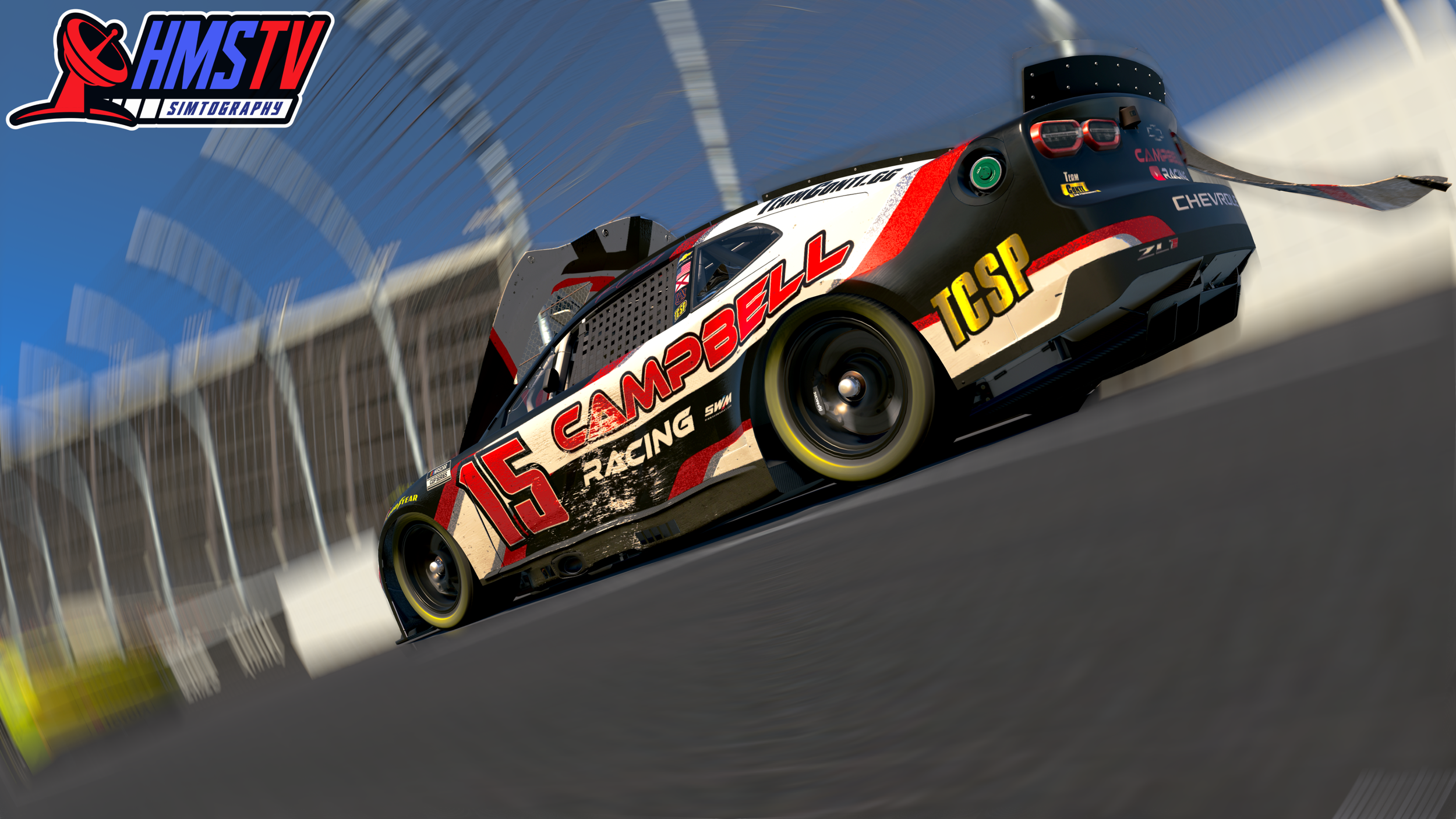 A race car on a track with a blue sky and a safety fence in the background, branded with the number 15 and sponsor names Campbell and ICSP.