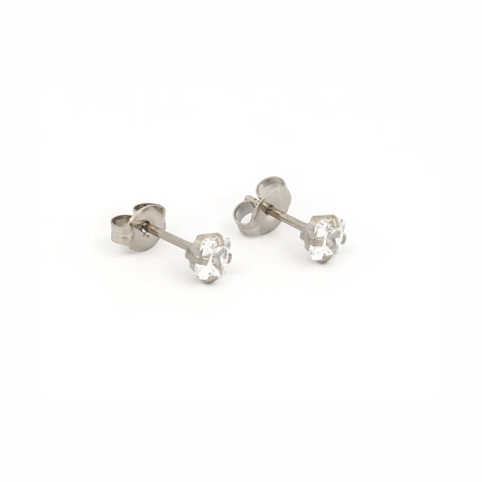 A pair of silver stud earrings with clear gemstone centers on a white background.