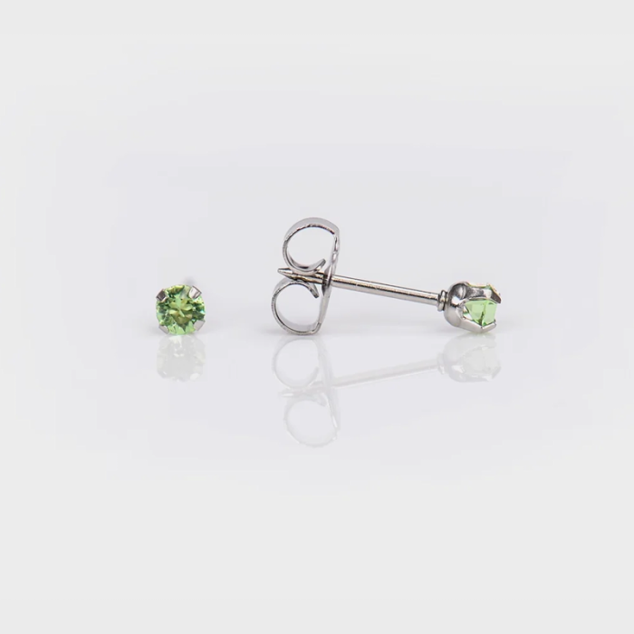 A pair of silver stud earrings with light green gemstones on a white background, one earring shown from the front and the other from the side.