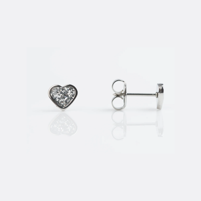 Silver heart-shaped stud earrings with glittering stones, one earring displayed front and the other showing the side view with post and backing