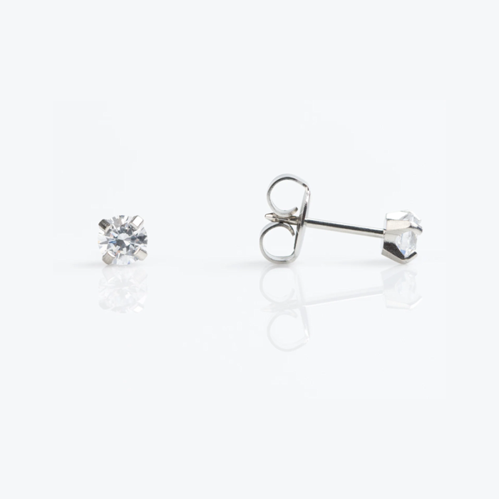 Close-up of a pair of diamond stud earrings on a white background, one showing the front view and the other showing the back with the earring post.