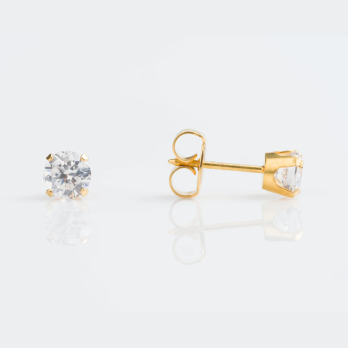 Gold stud earrings with large clear gemstones on a white background.
