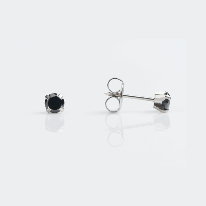 A pair of black gemstone stud earrings on a white background, with one earring featuring the gemstone and the other showing the silver post and backing.
