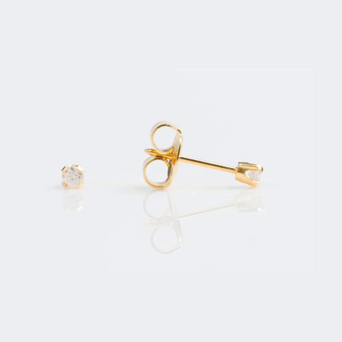 A pair of gold stud earrings with small diamonds on a white background.