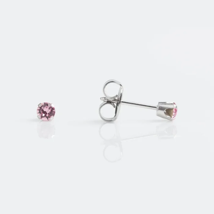 Silver stud earrings with pink gemstones on a white background.