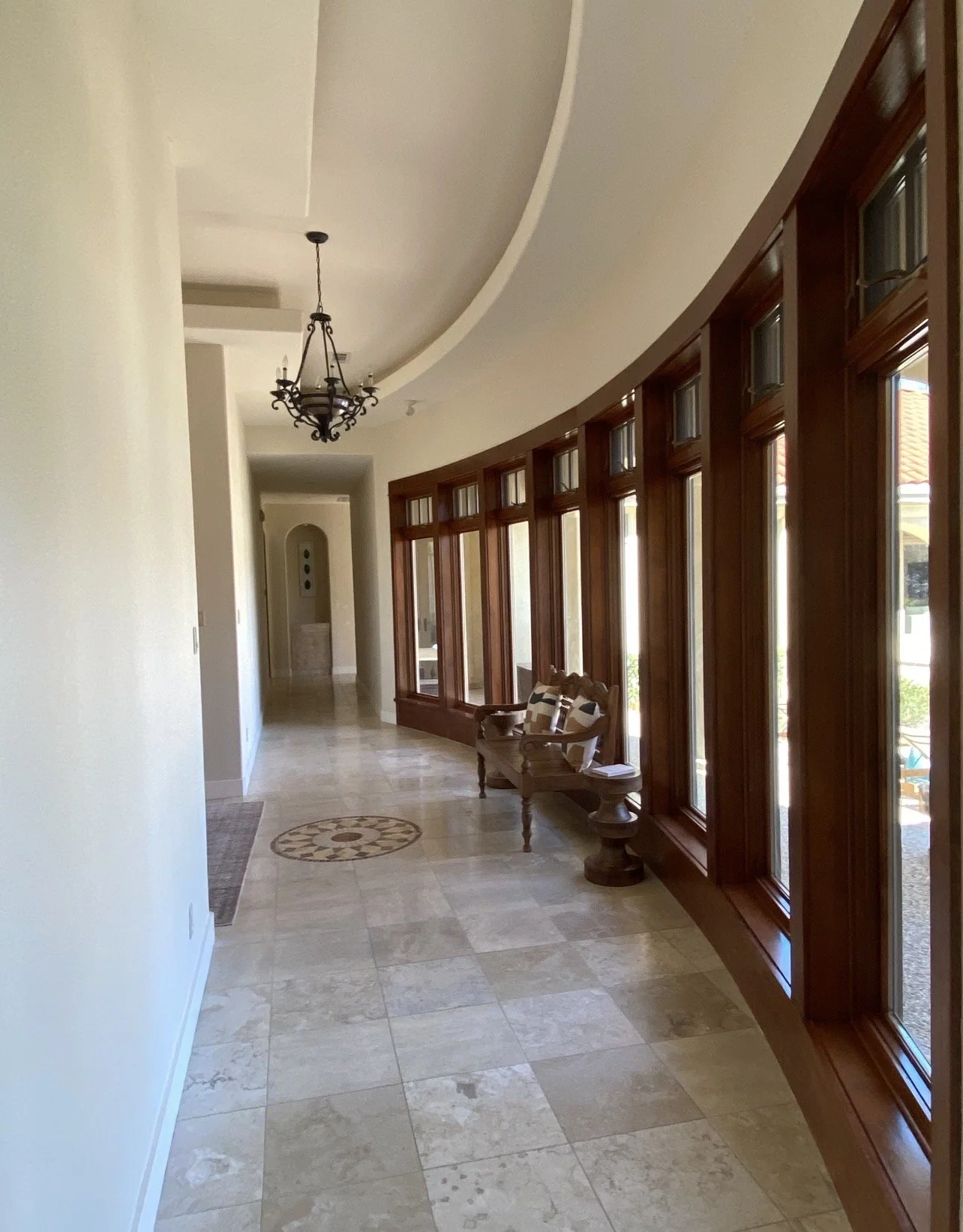 Professionally cleaned luxury short-term rental hallway and common area featuring spotless floors, polished surfaces, upscale furnishings, and five-star guest-ready presentation.