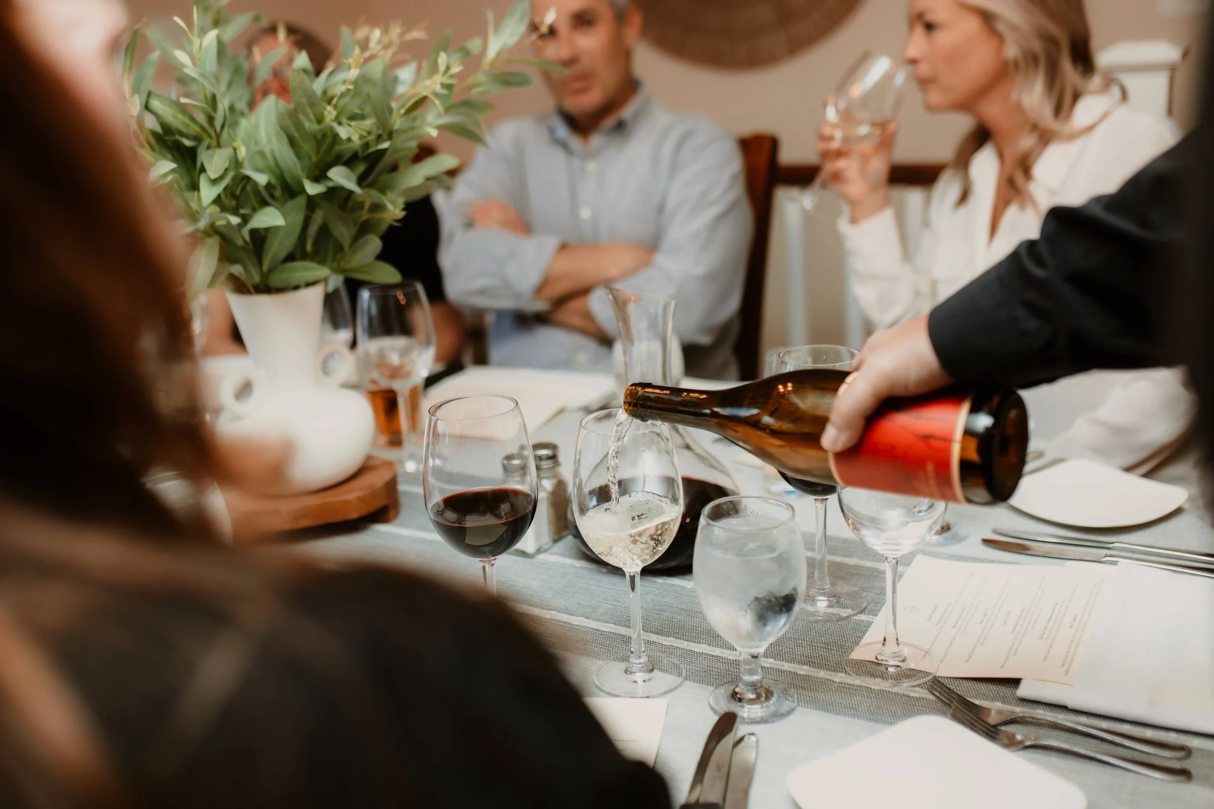 Pouring Wine at Table.jpg