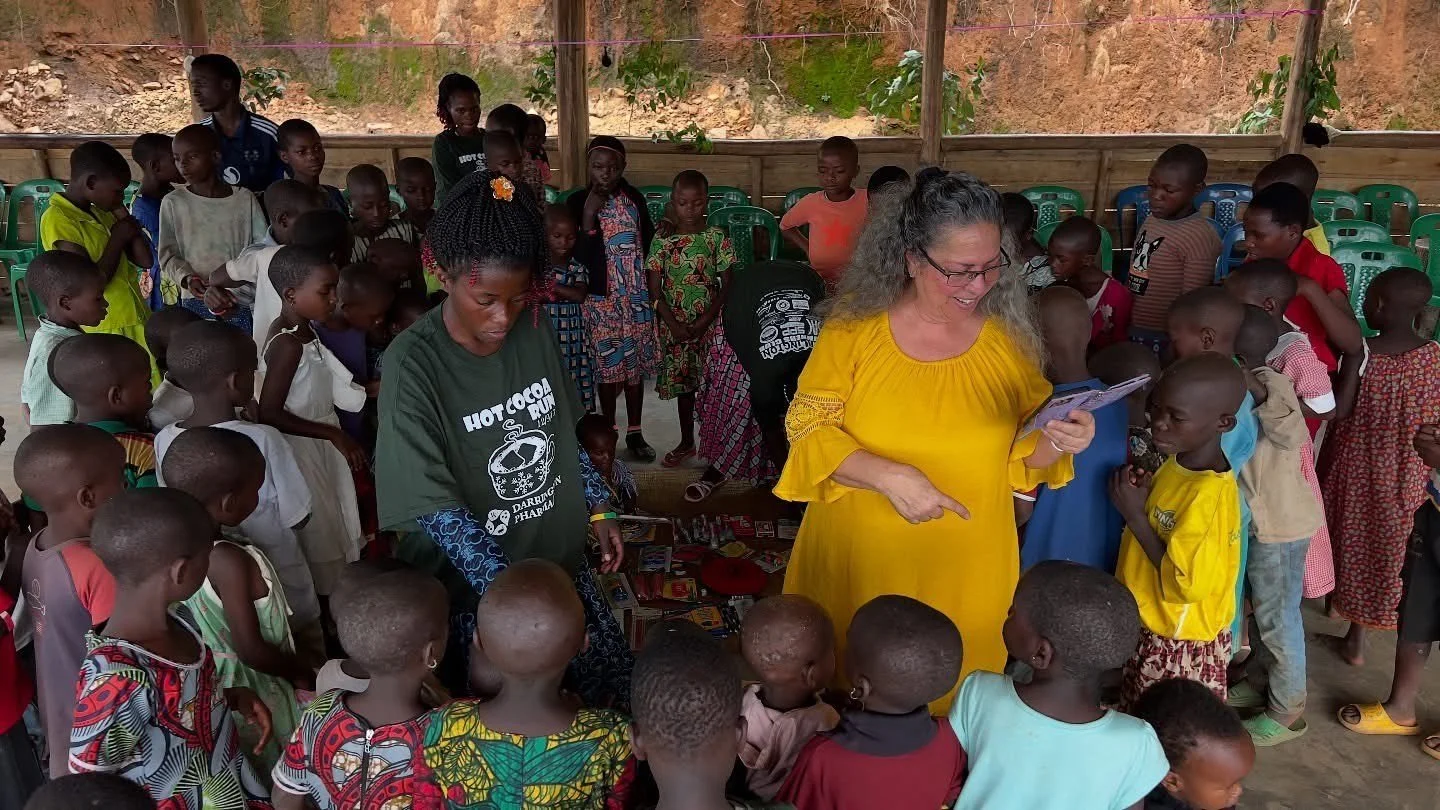 Gloria Cooper with a large group of Batwa children at the Heart 2 Heart School in Uganda, Africa