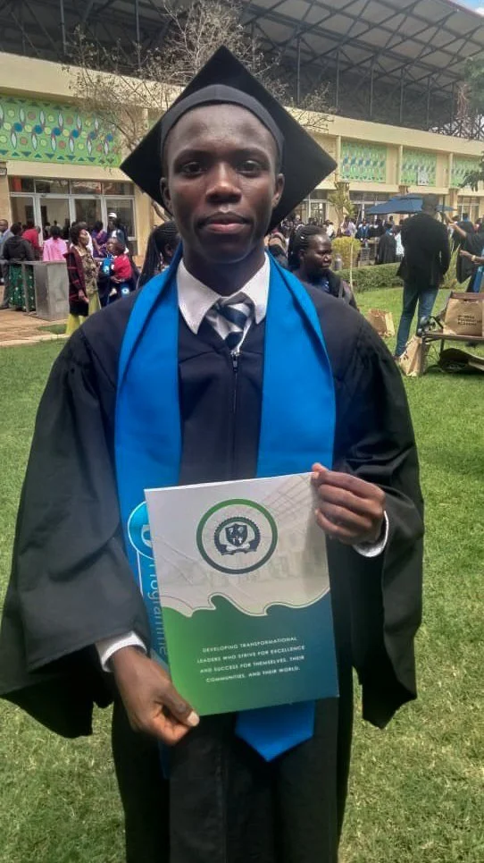 Julius in his cap and gown at his graduation