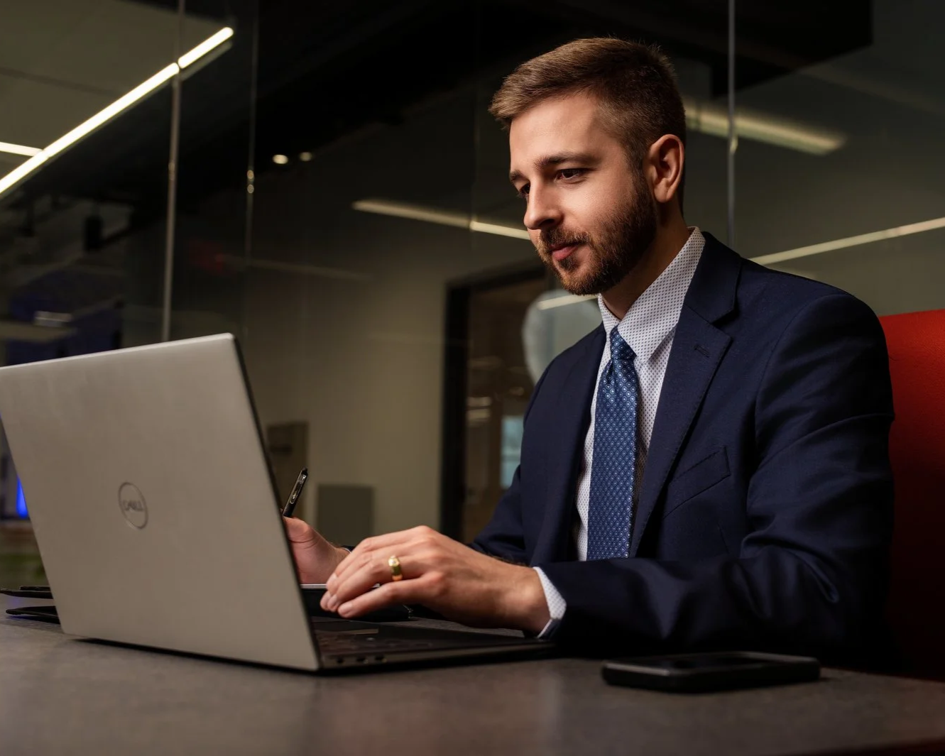 Financial professional Logan Foster performing a deep-dive analysis into tax-efficient withdrawal strategies for high-earning NIL professionals.
