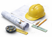 Construction tools including a yellow safety helmet, a rolled blueprint, a pencil, a measuring tape, and a ruler.