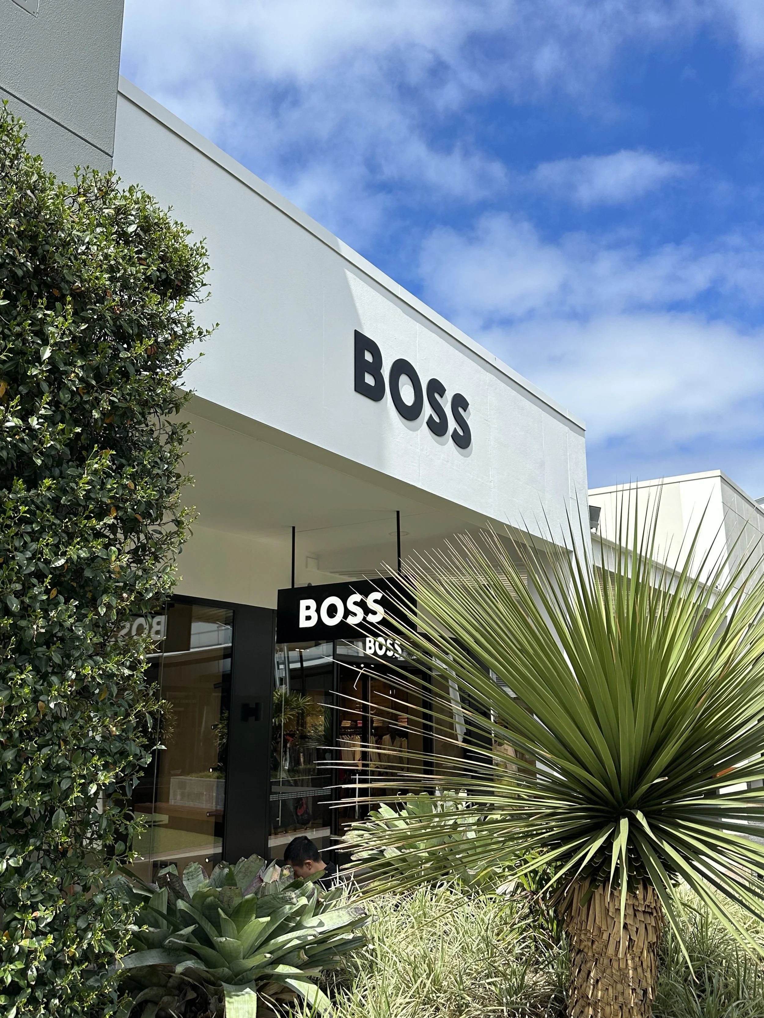 Exterior of a BOSS store, commercial signage projects completed