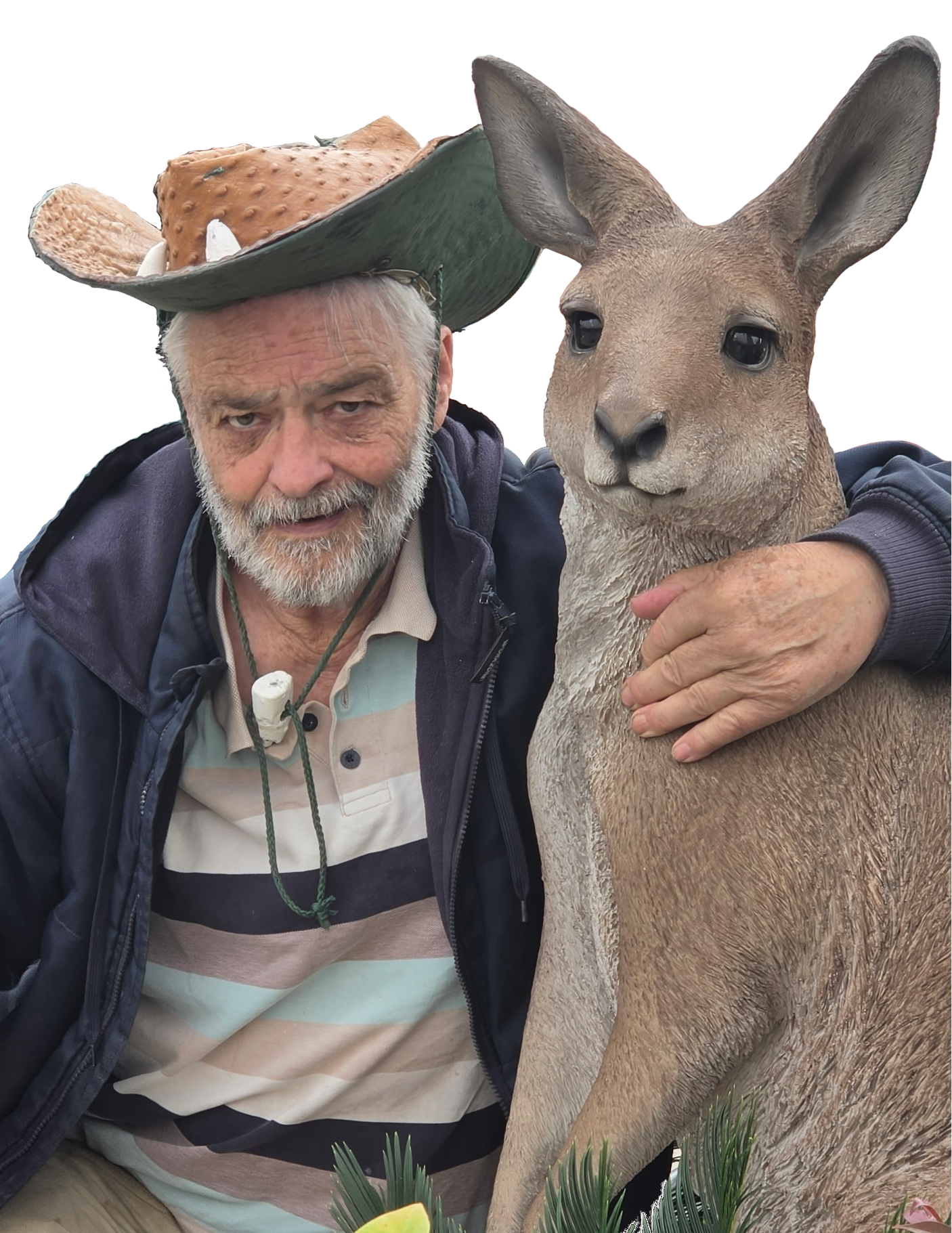 An older man with gray hair and a beard takes a selfie with a kangaroo. The man is wearing a jacket and a striped polo shirt, and he has a hat made of a large mushroom on his head. The kangaroo is standing next to him and resting its paw on his shoulder.