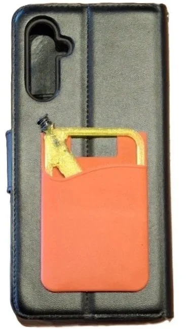 A phone case with a small plastic hot sauce bottle attached to a yellow spray nozzle.