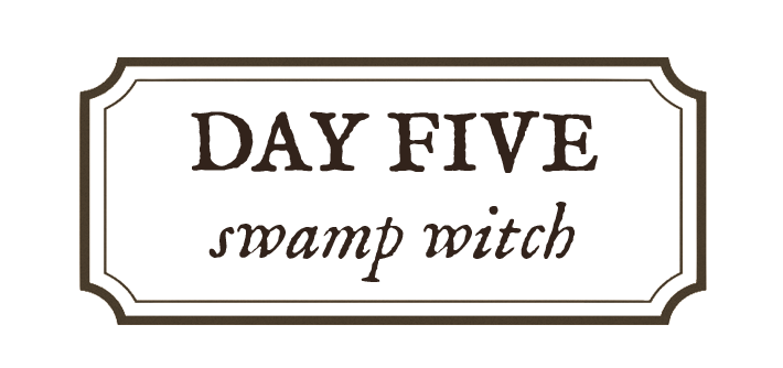Sign reading "Day Five Swamp Witch" with a decorative border.