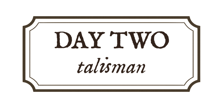 Decorative brown sign with empty space in the center, outlined with a subtle border.